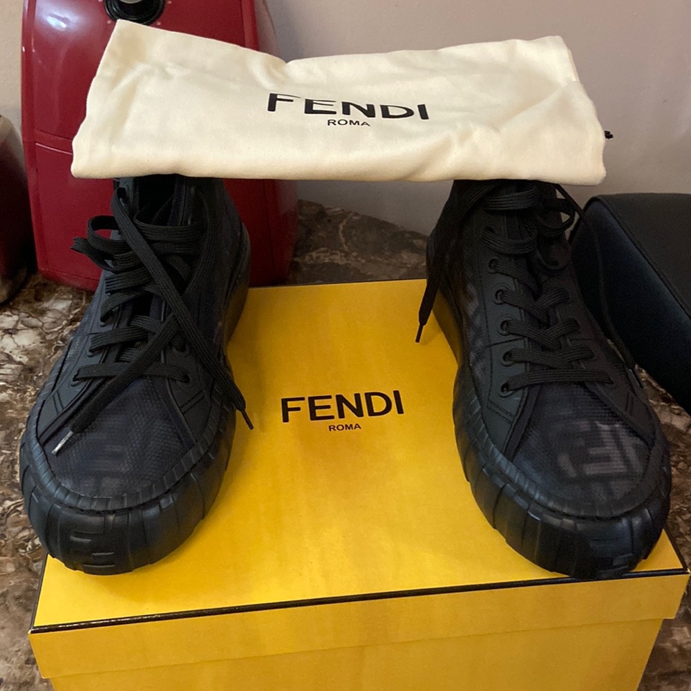 A pair of fendi black & navy blue in color sneaker for men 💋